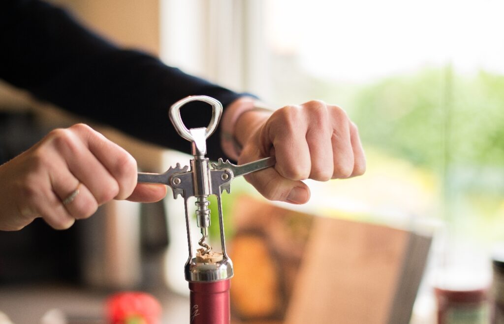 opening a wine bottle